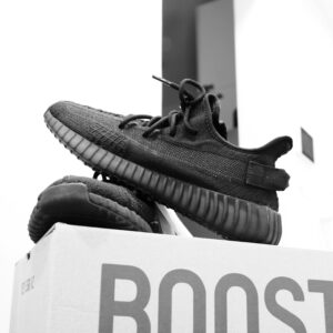 black sneakers on cardboard box display